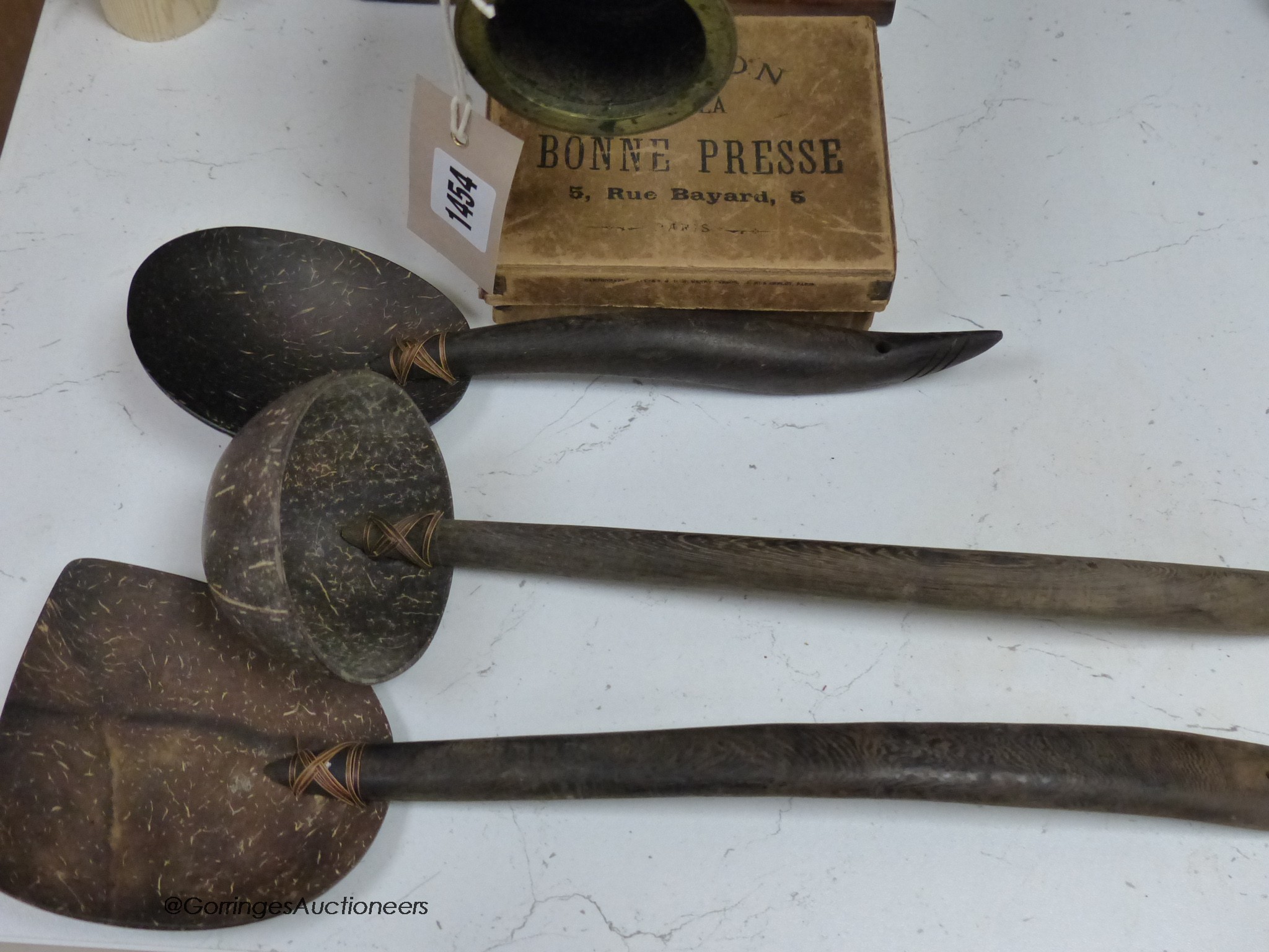 A Newton & Co Magic Lantern with slides and a group of three coconut domestic ladles